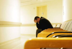 "Man sits alone, worried and waiting for his destiny to unfold."