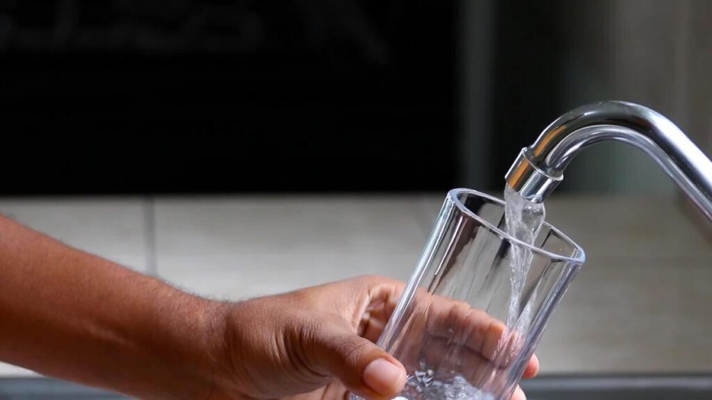 man-hands-pouring-fresh-tap-water-into-a-glass-cup-from-kitchen-faucet-video