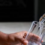 man-hands-pouring-fresh-tap-water-into-a-glass-cup-from-kitchen-faucet-video