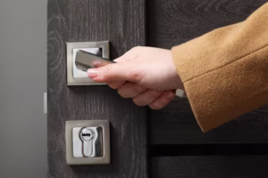 woman-opening-wooden-door-indoors-closeup-hand-handle_495423-77093